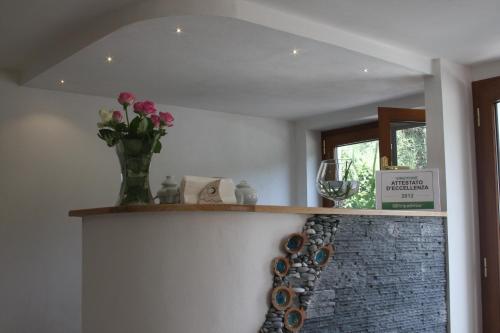 a bunch of wine bottles on a shelf in a room at B&B Le Giare in Monterosso al Mare