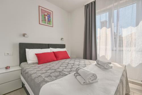 Postel nebo postele na pokoji v ubytování Ancora Center Apartment