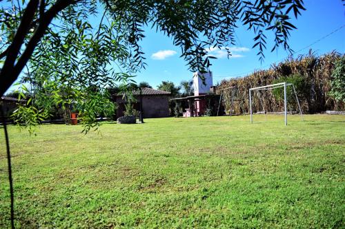 an open field with a soccer goal at Cabañas Villa del Sol in Salta