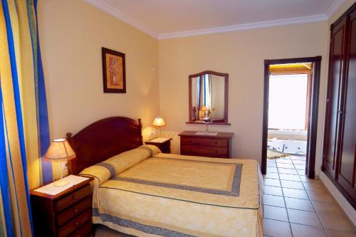 Ένα ή περισσότερα κρεβάτια σε δωμάτιο στο Villas Brisas del Mar