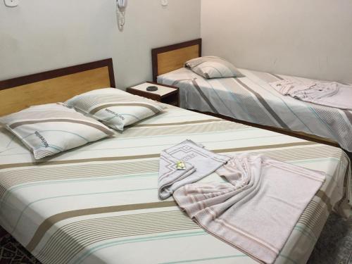Katil atau katil-katil dalam bilik di Hotel Ferreira Viana