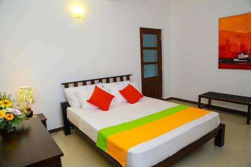 Giường trong phòng chung tại Miyura Holiday Bungalow