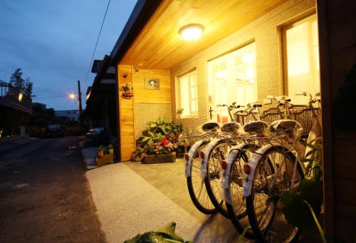a group of bikes parked outside of a building at Bei Yue B&B in Luodong
