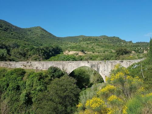 a stone bridge in the middle of a mountain at Mas del Sord 1335 in La Selva del Camp