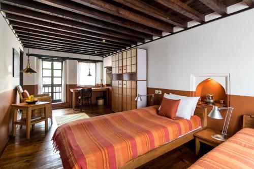 Ένα ή περισσότερα κρεβάτια σε δωμάτιο στο Milla Guesthouse Bhaktapur