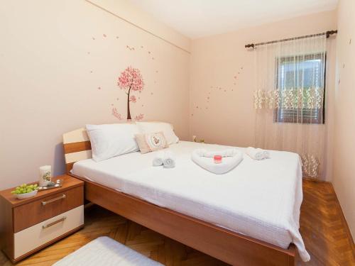 מיטה או מיטות בחדר ב-Holiday House Stari Volat