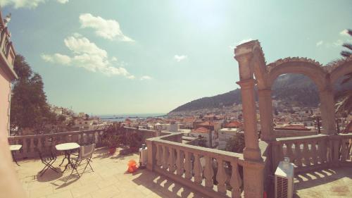 a balcony with a view of a city at Villa Melina Hotel in Kalymnos