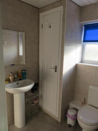a bathroom with a sink and a toilet at Apple Tree Corner Apartment in Yate