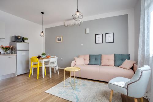 a living room with a couch and a table at Apartment Argo in Zagreb