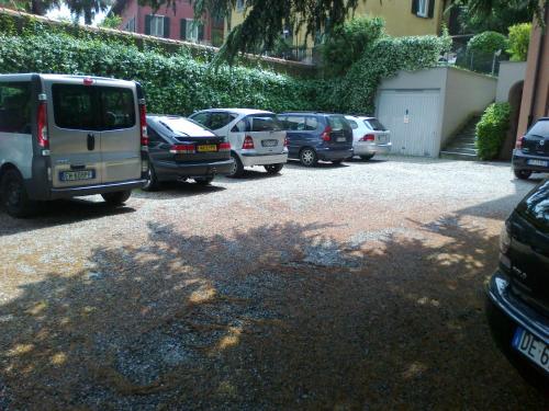 a bunch of cars parked in a parking lot at Cernobbio Residence in Cernobbio