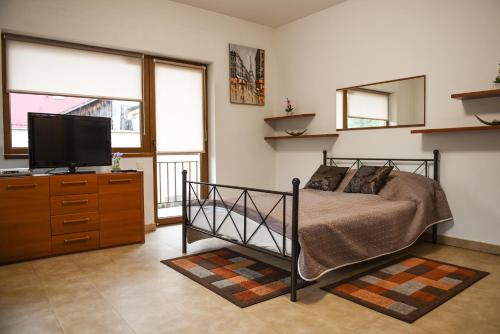 Кровать или кровати в номере Modern Apartment Near City Center