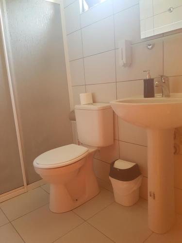 a bathroom with a toilet and a sink at Ada Adrasan Hotel in Adrasan