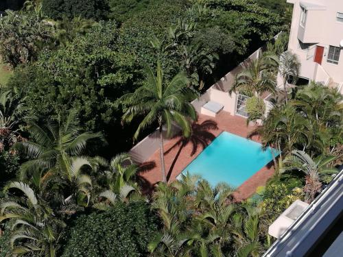 an overhead view of a swimming pool and trees at 404 Ipanema Beach in Durban