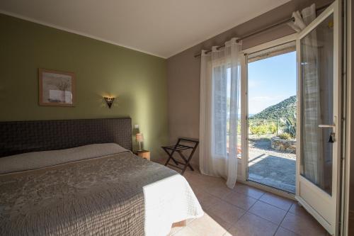 Postel nebo postele na pokoji v ubytování Auberge Lustincone