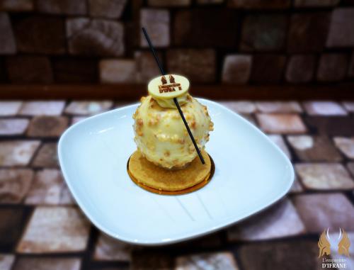 a dessert on a white plate on a table at L'empreinte D'ifrane in Ifrane