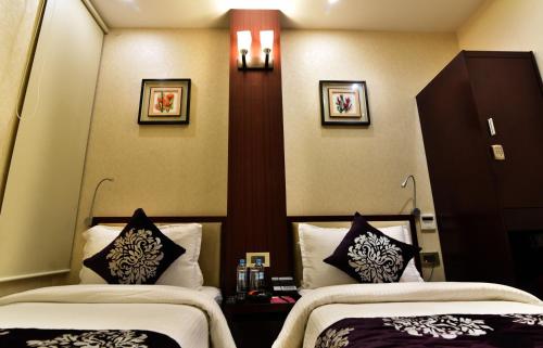 Hotel Kama Internationalにあるベッド