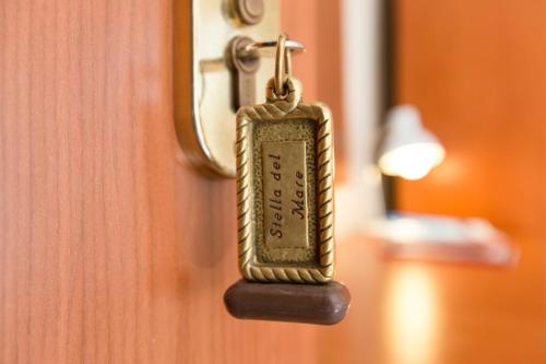 a close up of a door key on a door at Hotel Stella Del Mare in Cervia