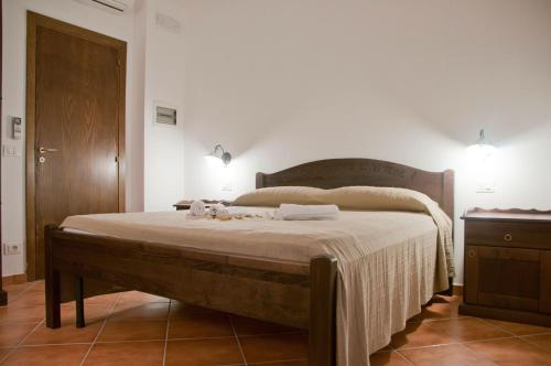 Ένα ή περισσότερα κρεβάτια σε δωμάτιο στο Casale Il Gheppio