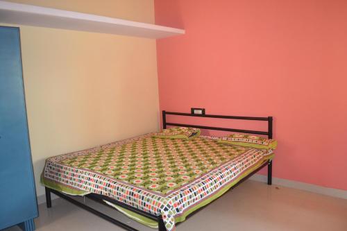 Postel nebo postele na pokoji v ubytování Manasvini Homestay-A home in Mysore with scenic view