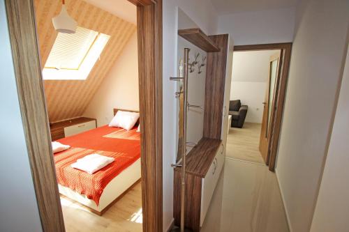 Postel nebo postele na pokoji v ubytování Lilly Apartments