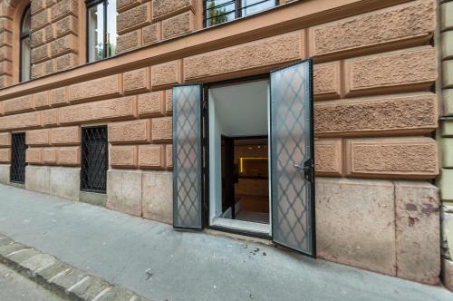 an open door on a brick building at Castle Suite in Budapest