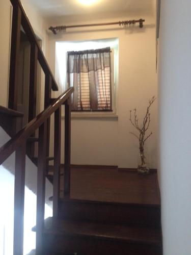 a staircase leading to a room with a window at Apartment Rustic Jolly in Premantura