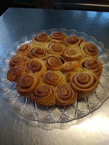 a large glass plate of donuts on a table at Hotel Casa Nicola in Ischia