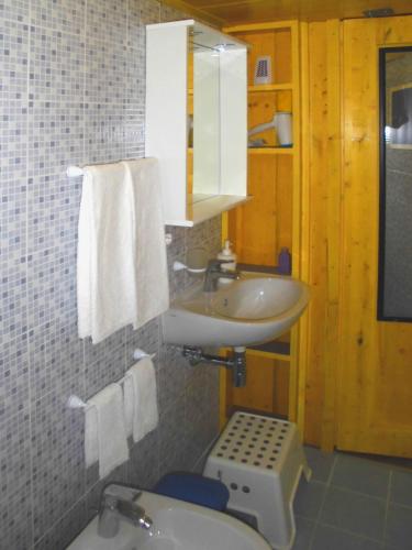 a bathroom with a sink and a toilet at Graziella 27 in Naples