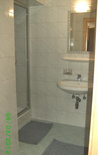 a bathroom with a shower and a sink at Apart Dorfblick in Kaunertal