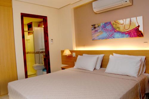 Ένα ή περισσότερα κρεβάτια σε δωμάτιο στο Kariri Beach Hotel