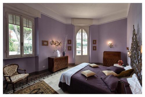 A bed or beds in a room at Villa Italy