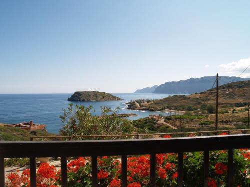 a view of the ocean from a balcony at Limenaria Apartments in Mochlos
