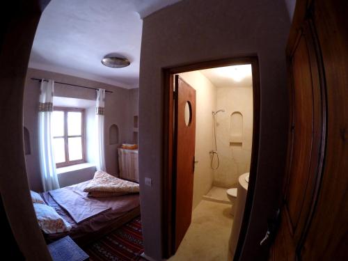 En eller flere senger på et rom på La Kasbah du M'goun