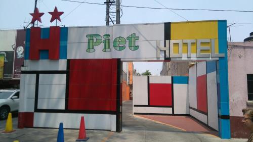 a colorful sign for a pet store on a street at Hotel H - Piet Adults Only in Mexico City