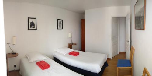 Ένα ή περισσότερα κρεβάτια σε δωμάτιο στο Les Fontaines