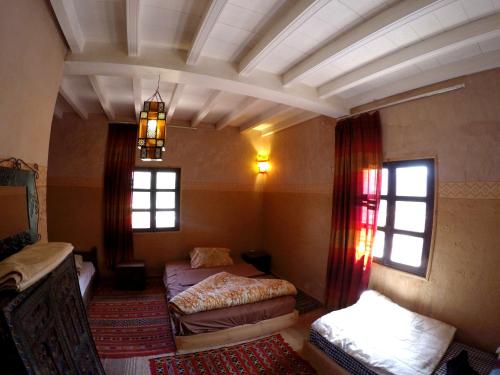 Säng eller sängar i ett rum på La Kasbah du M'goun