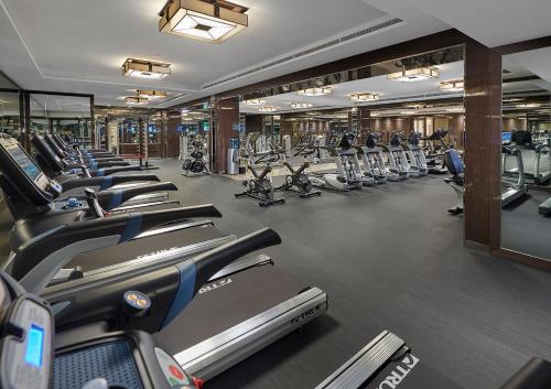 a gym with a row of treadmills and machines at Crown Towers Perth in Perth