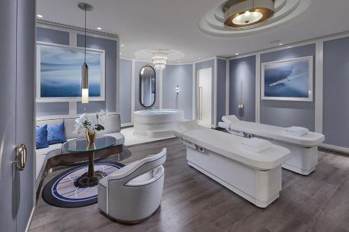 a bathroom with two sinks and a bath tub at Crown Towers Perth in Perth