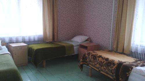 En eller flere senge i et værelse på Rubeni