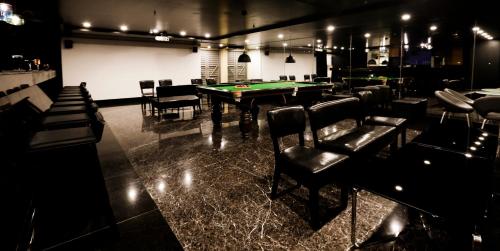 a room with a ping pong table and chairs at Zone By The Park, ORR, Chennai in Chennai