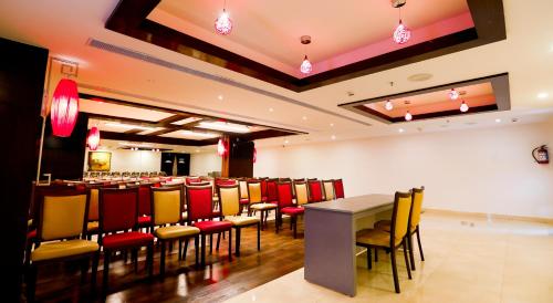 a conference room with a long table and chairs at Zone By The Park, ORR, Chennai in Chennai
