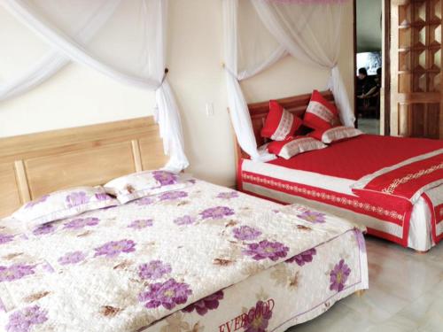 Ένα ή περισσότερα κρεβάτια σε δωμάτιο στο Tom Homestay