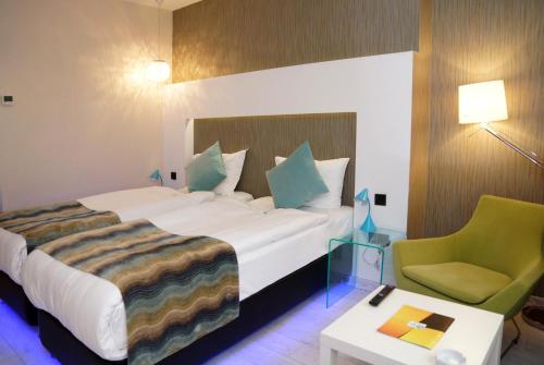 Postel nebo postele na pokoji v ubytování Tempo Hotel 4Levent