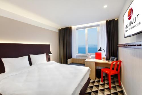 Säng eller sängar i ett rum på AZIMUT City Hotel Vladivostok