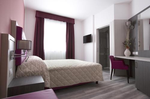 Cama o camas de una habitación en Alma Living Hotel- Al Girarrosto