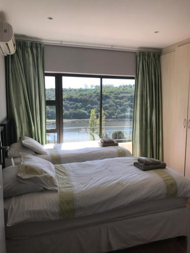 Ένα ή περισσότερα κρεβάτια σε δωμάτιο στο Waterryk Eco Guest Farm