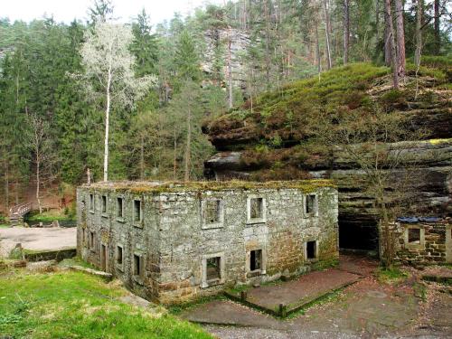 an old stone building on the side of a mountain at Pension Růžák in Růžová