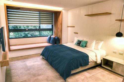 a bedroom with a large bed and a window at Doris Home in Yuchi