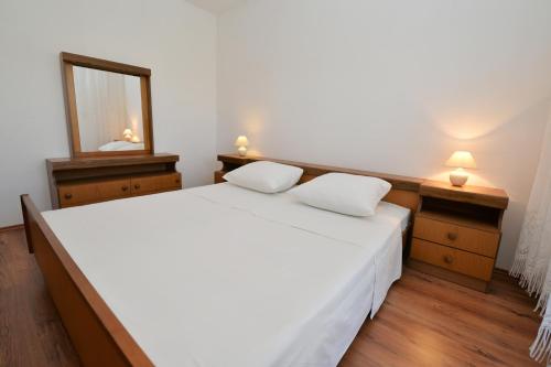 Katil atau katil-katil dalam bilik di Apartmani Šime