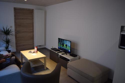 En tv och/eller ett underhållningssystem på Apartment Aurora